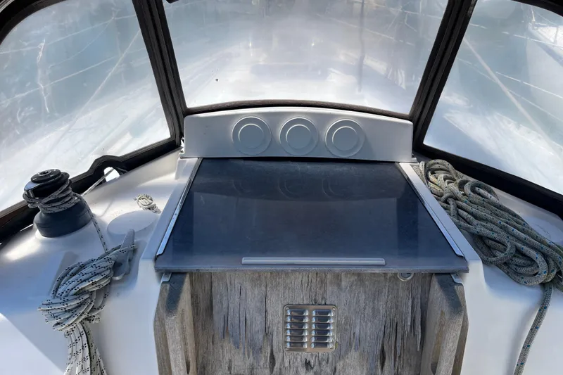 Slide: The Image of Cockpit view of 1986 Wauquiez Petorine sailboat with ropes and winch. - 4