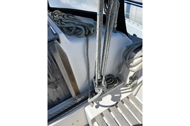 Slide: The Image of 1986 Wauquiez Petorine sailboat deck with ropes and rigging details. - 5
