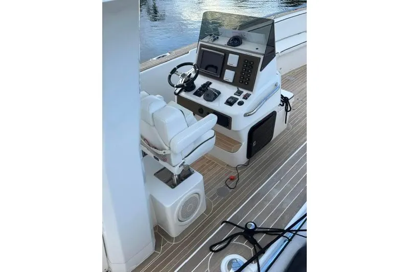 Slide: The Image of 2012 Novurania Chase boat helm with steering wheel, controls, and navigation equipment. - 5