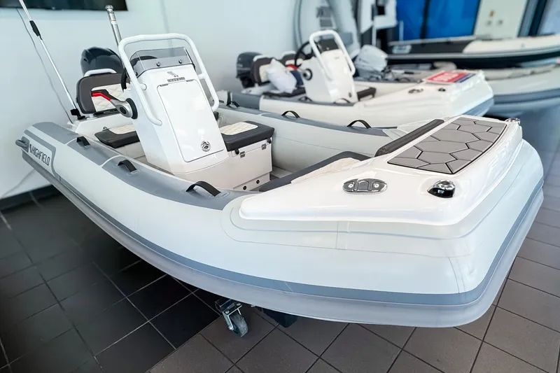 The Image of 2026 Highfield Sport 360 inflatable boat in a showroom. - 0