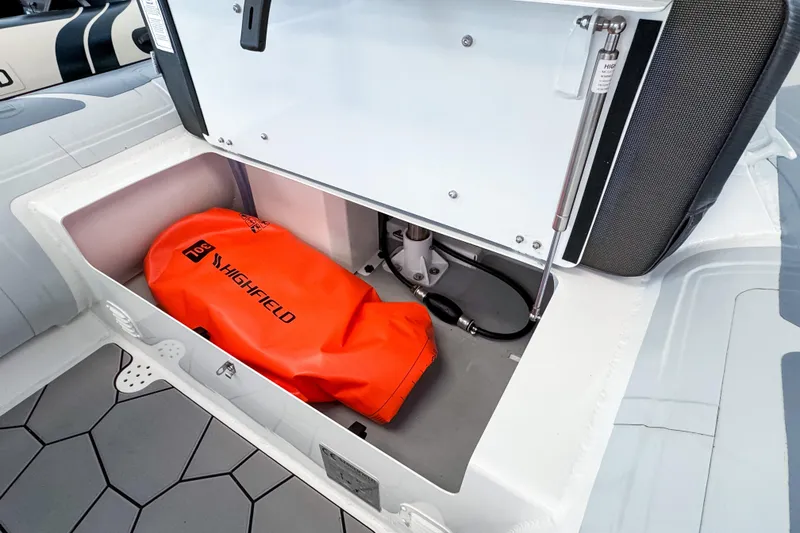 Slide: The Image of Storage compartment in Highfield Sport 360 boat with orange bag. - 6