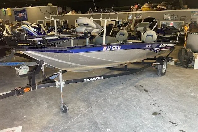 The Image of 2012 Bass Tracker Pro 17 boat on trailer in indoor storage. - 1