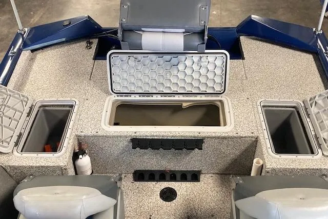 Slide: The Image of 2012 Bass Tracker Pro 17 boat interior with storage compartments and seating. - 11
