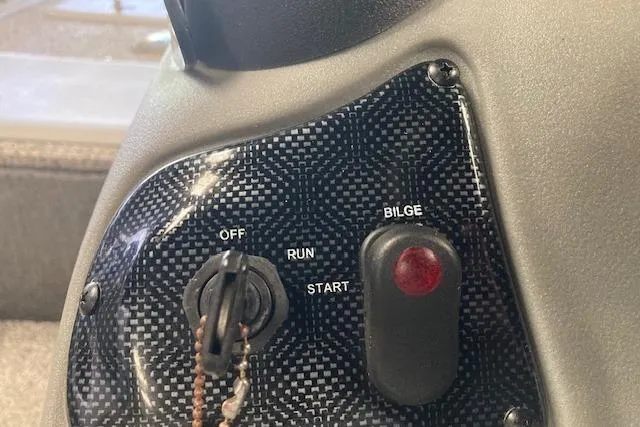 Slide: The Image of Control panel of a 2012 Bass Tracker Pro 17 boat with ignition and bilge switch. - 14