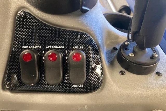 Slide: The Image of Control panel of a 2012 Bass Tracker Pro 17 boat with aerator and navigation light switches. - 15