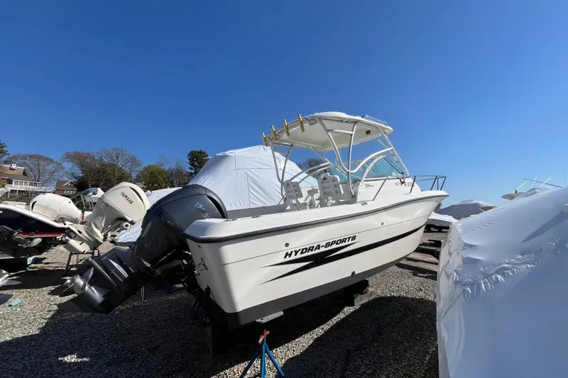 The Image of 2009 Hydra-Sports 2000 WA boat with Yamaha outboard, parked on gravel under clear blue sky. - 1