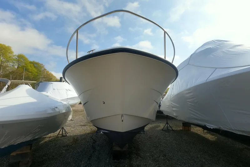 Slide: The Image of 2009 Hydra-Sports 2000 WA boat in storage, surrounded by covered vessels. - 10