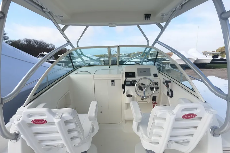 Slide: The Image of 2009 Hydra-Sports 2000 WA boat cockpit with steering wheel and dual seats. - 14