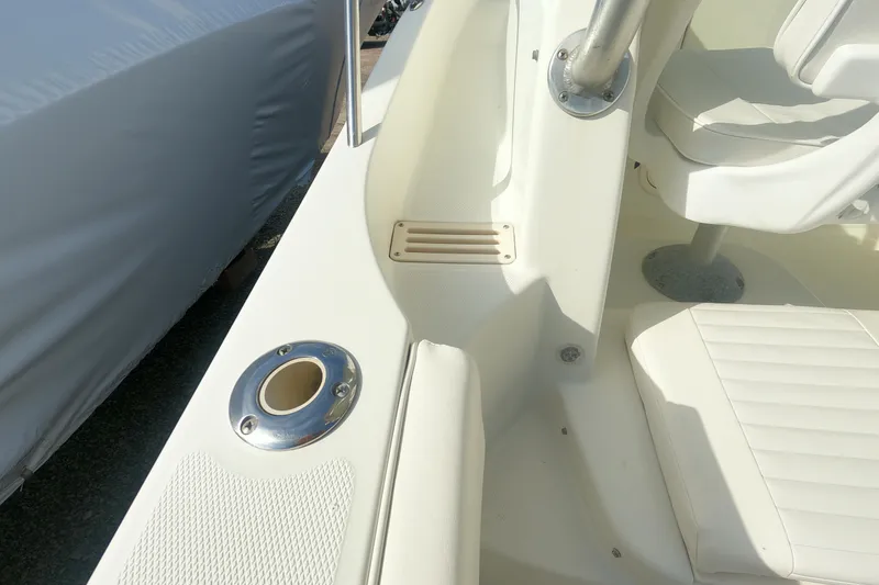 Slide: The Image of 2009 Hydra-Sports 2000 WA boat interior with white seating and stainless steel fixtures. - 18