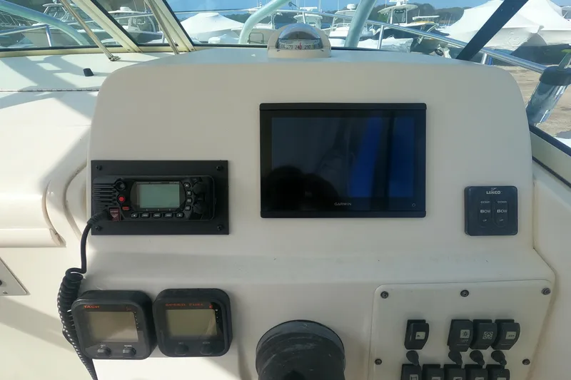 Slide: The Image of Dashboard of a 2009 Hydra-Sports 2000 WA boat with navigation and control instruments. - 19