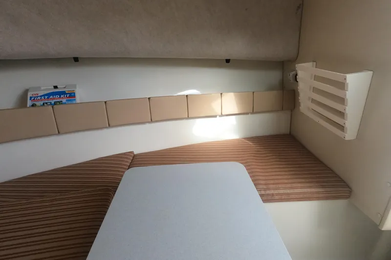 Slide: The Image of Interior cabin of 2009 Hydra-Sports 2000 WA boat with seating and first aid kit. - 21