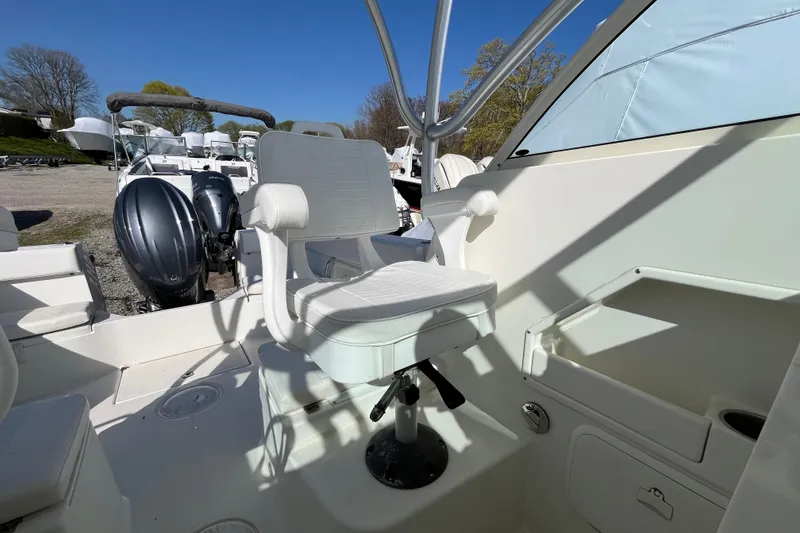 Slide: The Image of 2009 Hydra-Sports 2000 WA boat interior with captain's chair and dual outboard motors. - 29