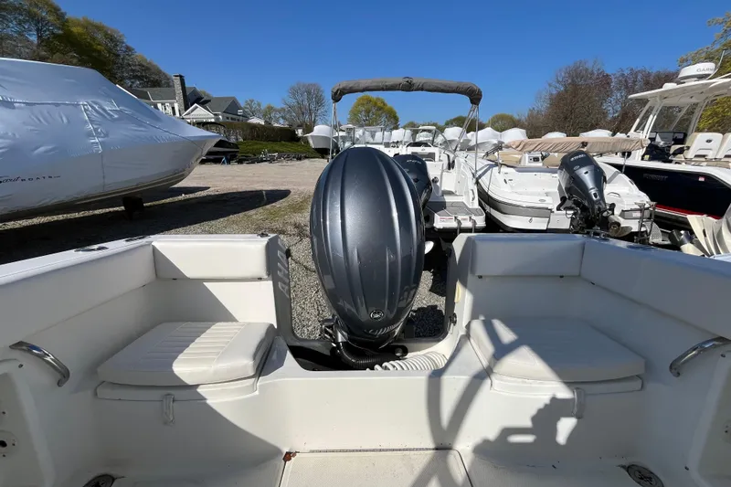 Slide: The Image of 2009 Hydra-Sports 2000 WA boat with outboard motor, docked in a marina. - 34