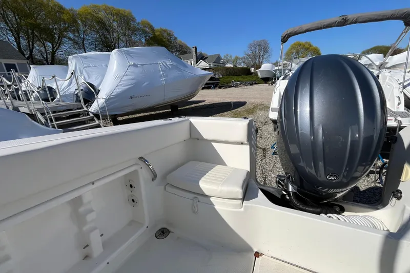 Slide: The Image of 2009 Hydra-Sports 2000 WA boat with outboard motor in a marina setting. - 35