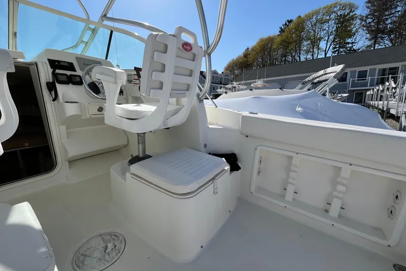 Slide: The Image of 2009 Hydra-Sports 2000 WA boat interior with captain's chair and control panel. - 36