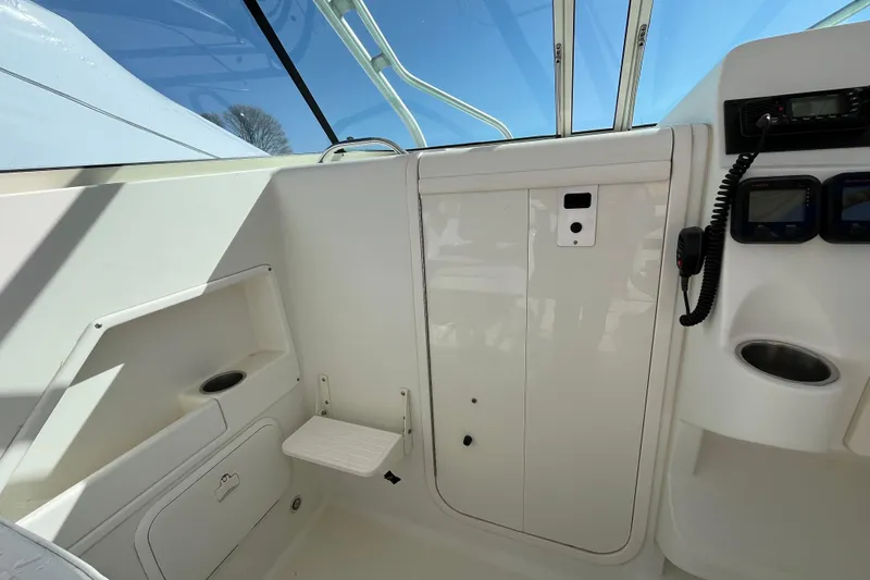 Slide: The Image of 2009 Hydra-Sports 2000 WA boat interior with control panel and seating area. - 38