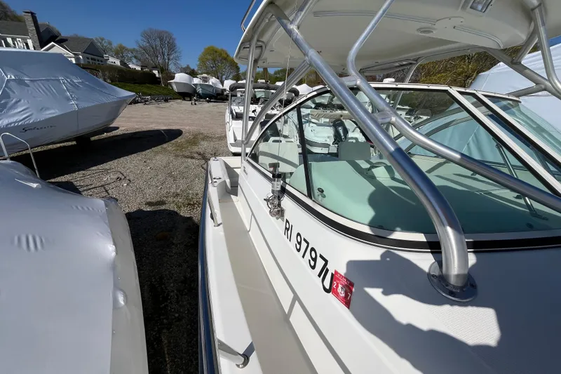 Slide: The Image of 2009 Hydra-Sports 2000 WA boat parked outdoors, surrounded by other covered boats. - 41