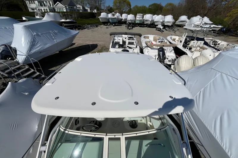 Slide: The Image of 2009 Hydra-Sports 2000 WA boat in storage yard, surrounded by covered vessels. - 42