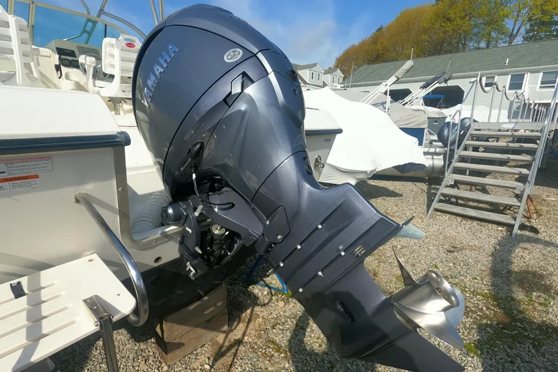Slide: The Image of 2009 Hydra-Sports 2000 WA boat with Yamaha outboard motor, parked on gravel. - 7