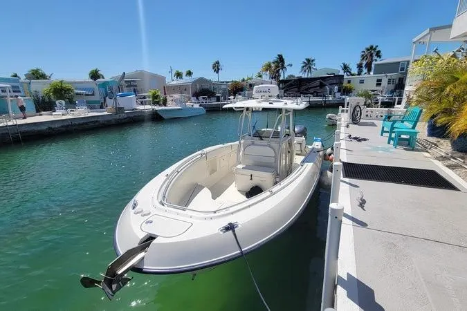 Slide: The Image of 2006 Hydra-Sports Vector 2900 CC boat docked in a sunny marina setting. - 2