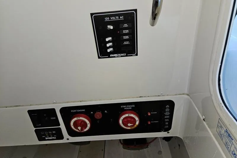 Slide: The Image of 2006 Hydra-Sports Vector 2900 CC electrical panel with switches and controls. - 24