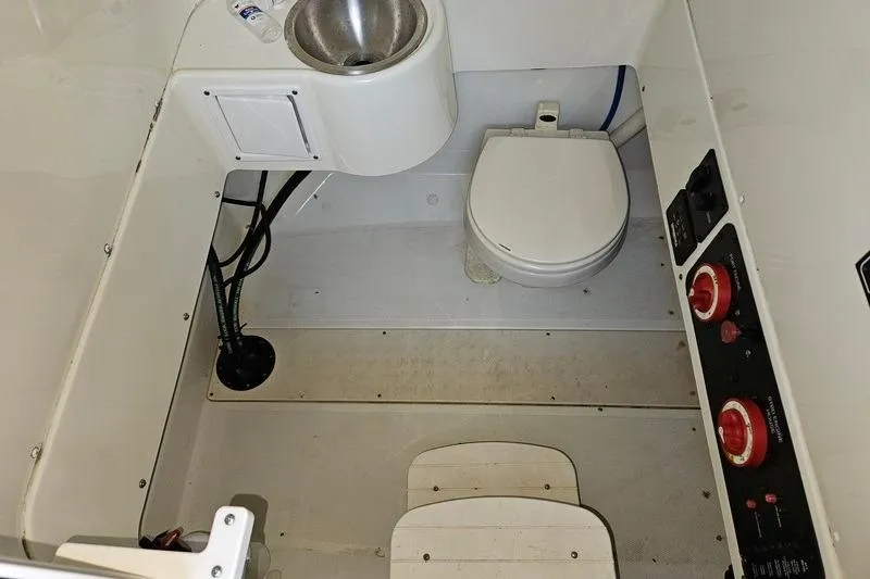 Slide: The Image of 2006 Hydra-Sports Vector 2900 CC boat interior with toilet and sink. - 25