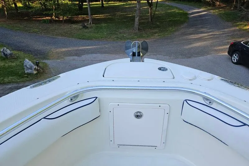 Slide: The Image of 2006 Hydra-Sports Vector 2900 CC boat bow with seating and anchor, parked on a driveway. - 27