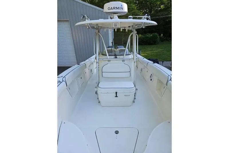 Slide: The Image of 2006 Hydra-Sports Vector 2900 CC boat interior with Garmin equipment, docked near a garage. - 29