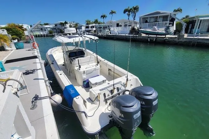 Slide: The Image of 2006 Hydra-Sports Vector 2900 CC boat docked in a canal with twin Yamaha engines. - 3