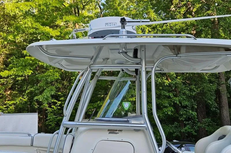Slide: The Image of 2006 Hydra-Sports Vector 2900 CC boat with radar, surrounded by lush greenery. - 33