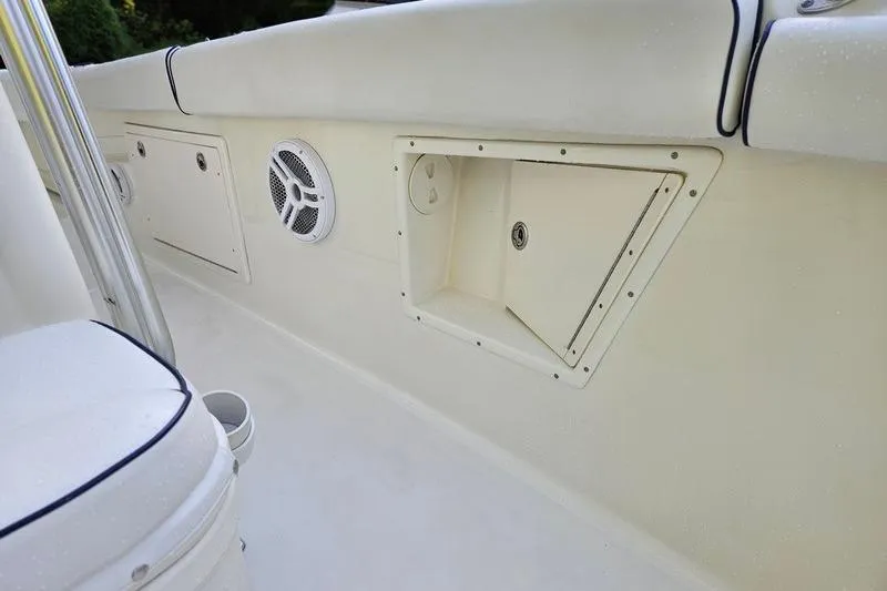 Slide: The Image of 2006 Hydra-Sports Vector 2900 CC boat interior with storage compartments and speaker. - 34