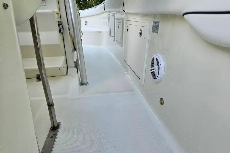Slide: The Image of 2006 Hydra-Sports Vector 2900 CC boat interior with storage compartments and speaker. - 37