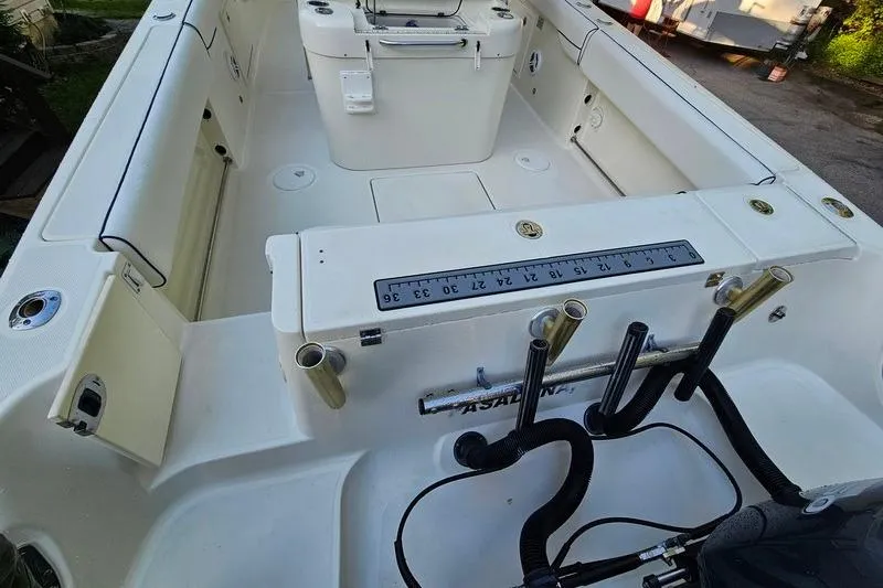 Slide: The Image of 2006 Hydra-Sports Vector 2900 CC boat interior with fishing rod holders and measuring scale. - 9