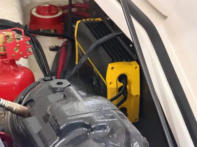 Slide: The Image of Engine compartment of a 2016 Regal 24 FasDeck RX boat with equipment. - 17