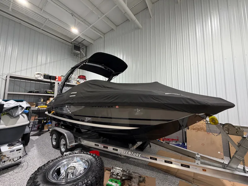 Slide: The Image of 2016 Regal 24 FasDeck RX boat in warehouse on trailer. - 2