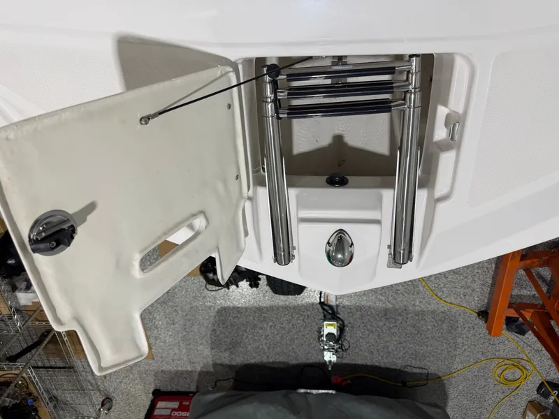 Slide: The Image of Regal 24 FasDeck RX 2016 boat with retractable swim ladder. - 24