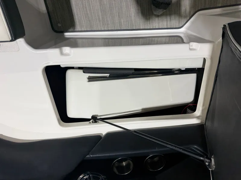 Slide: The Image of Regal 24 FasDeck RX 2016 storage compartment with open hatch. - 25