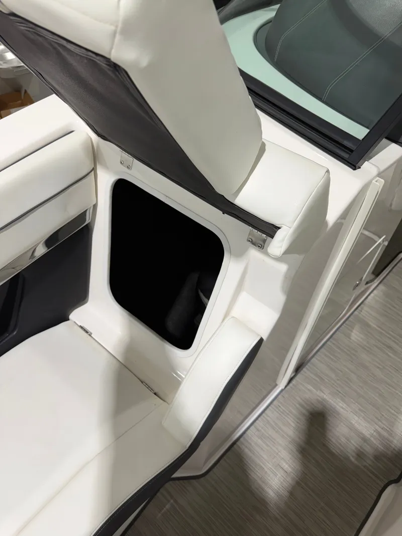 Slide: The Image of Regal 24 FasDeck RX 2016 boat seat with storage compartment. - 26