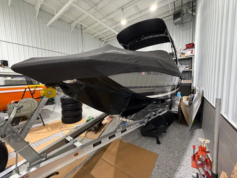 Slide: The Image of 2016 Regal 24 FasDeck RX boat in storage on trailer. - 5
