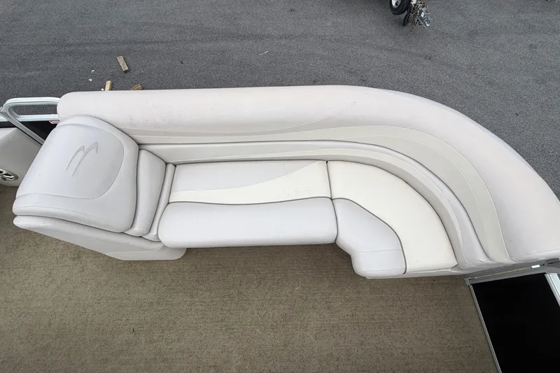Slide: The Image of 2013 Bennington 2375 GCW boat seating, featuring white cushioned upholstery on a pontoon deck. - 10
