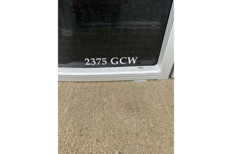 Slide: The Image of Close-up of 2013 Bennington 2375 GCW model label on boat surface. - 13