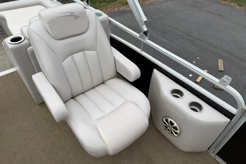 Slide: The Image of Luxurious seating on 2013 Bennington 2375 GCW pontoon boat with cup holders and speaker. - 15