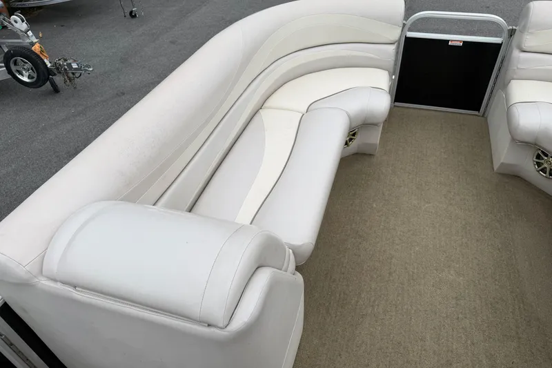 Slide: The Image of 2013 Bennington 2375 GCW pontoon boat interior with plush seating and carpeted floor. - 18