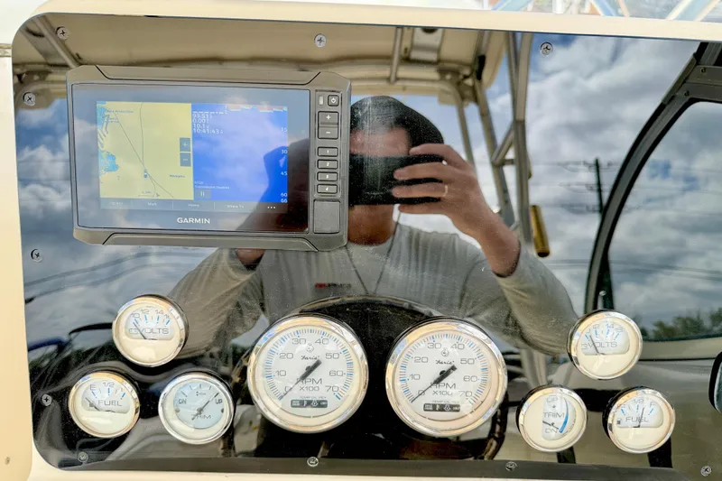 Slide: The Image of Dashboard of a 2007 World Cat 250 DC boat with Garmin GPS and gauges. - 11