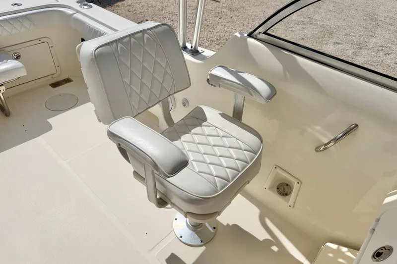 Slide: The Image of Luxurious seating on a 2007 World Cat 250 DC boat, featuring quilted upholstery. - 17