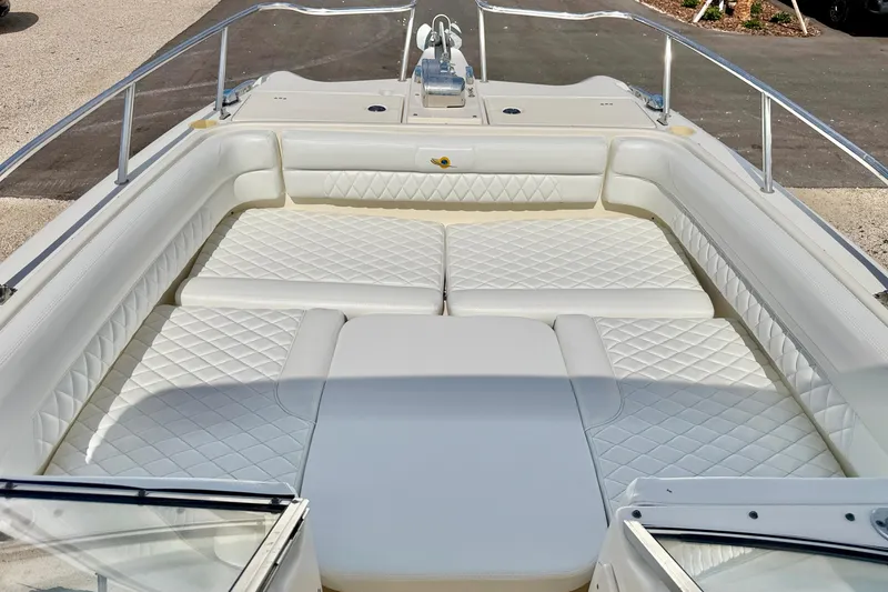 Slide: The Image of 2007 World Cat 250 DC boat interior with white quilted seating. - 19