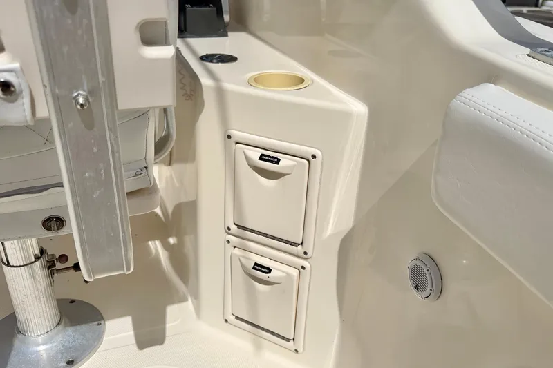 Slide: The Image of Interior of 2007 World Cat 250 DC boat showing storage compartments and seating. - 23