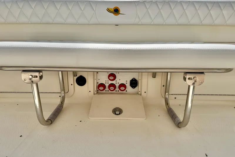 Slide: The Image of 2007 World Cat 250 DC boat interior with white seating and control panel. - 27