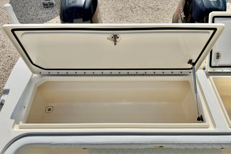 Slide: The Image of Open storage compartment on a 2007 World Cat 250 DC boat. - 28