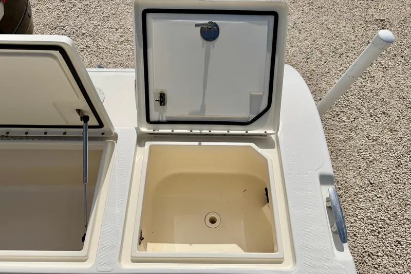Slide: The Image of Open storage compartments on a 2007 World Cat 250 DC boat, showcasing interior space. - 29